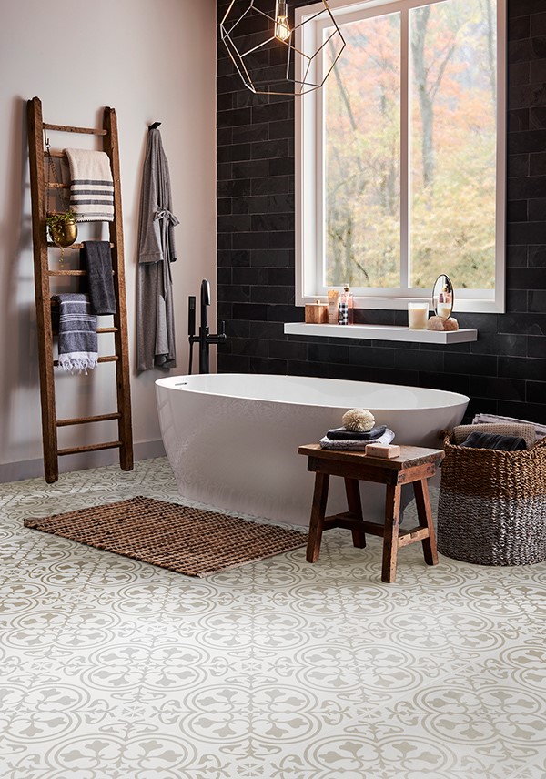 Bathroom with light colored and patterned laminate floors